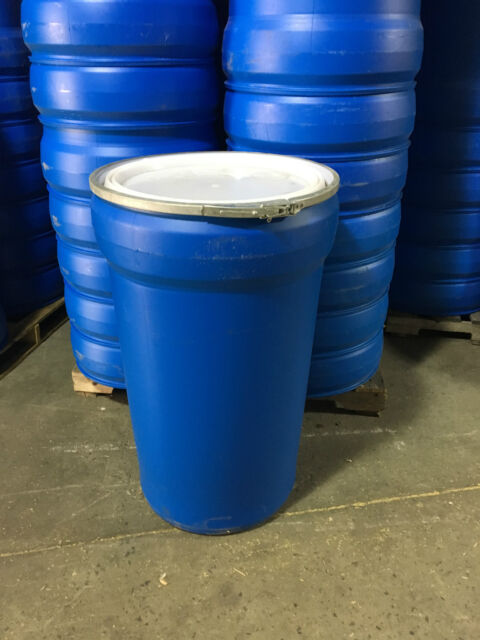 A 3 Gallon Open Head Fiber Drum sits on a concrete floor, with similar drums stacked in the background.